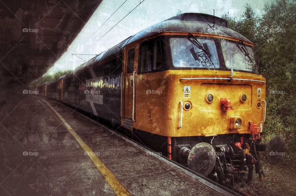 Class 47 Locomotives . A line of ageing Class 47 Locomotives in a deserted platform at the station.