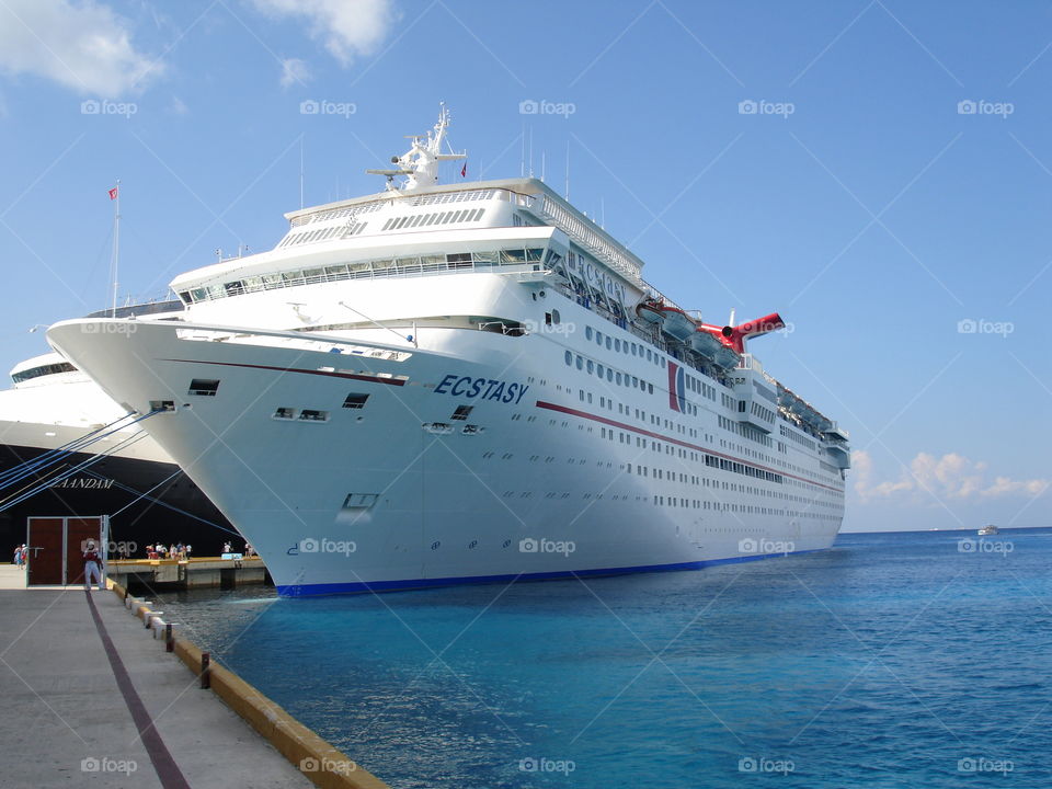 a cruise ship Ecstasy, ocean, blue sky