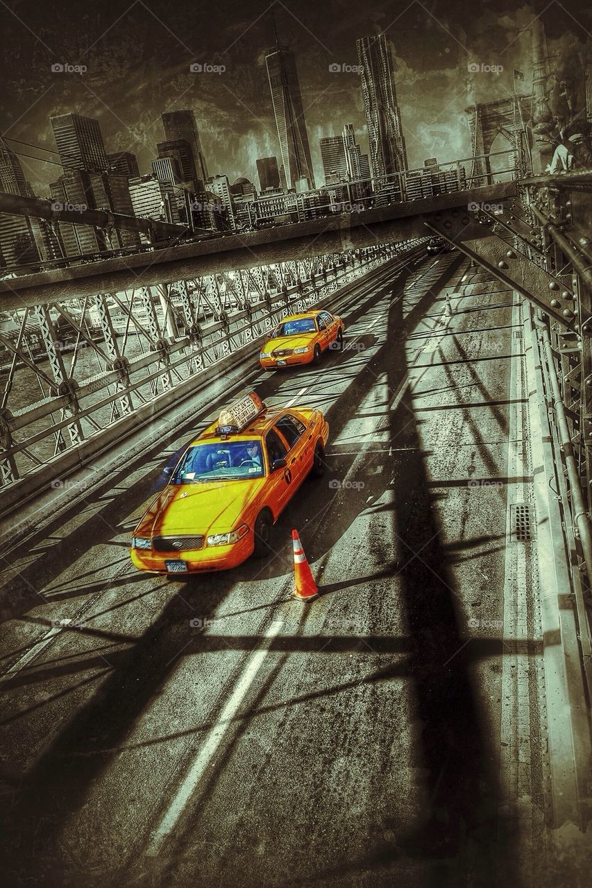 Yellow cab at the Brooklyn bridge