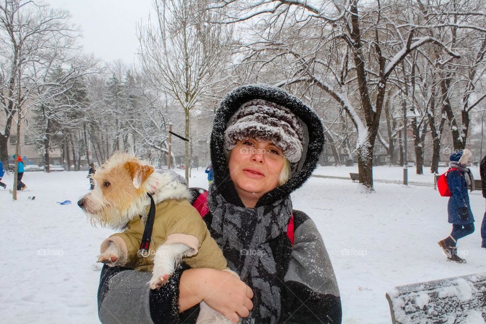 winter portrait of a lady and a dog