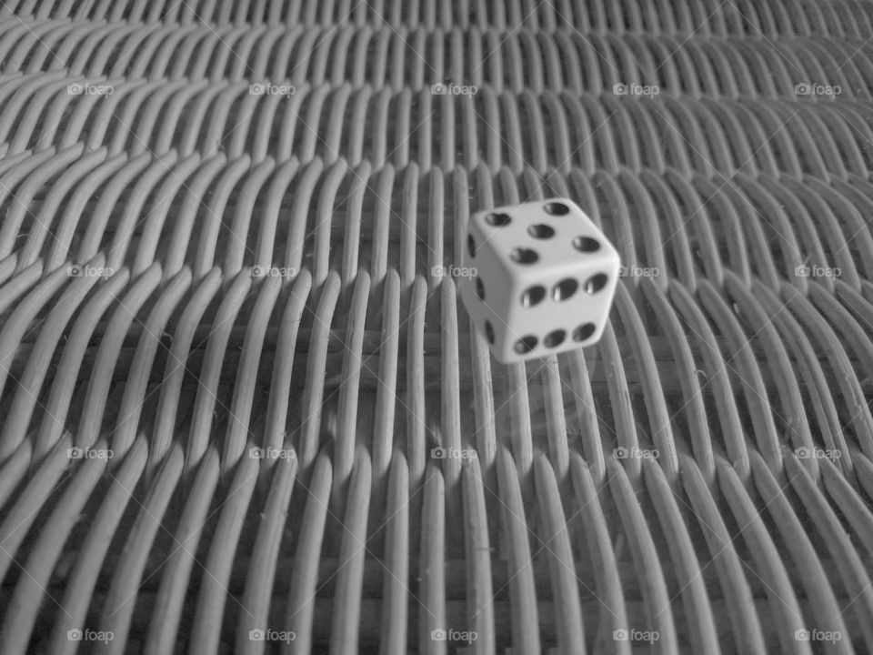 Random dice on wicker surface.