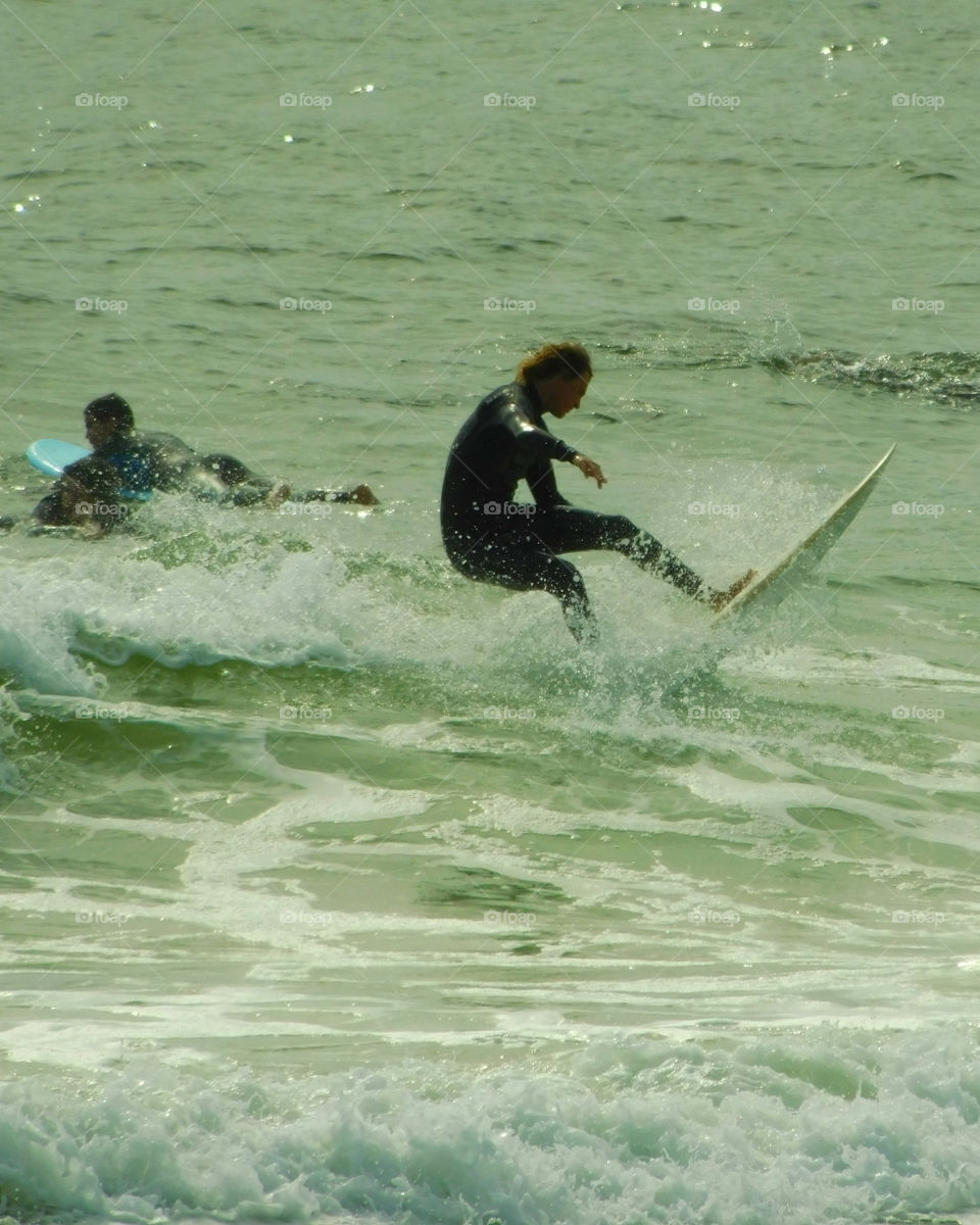 Surfers ride the waves in the Gulf of Mexico! 