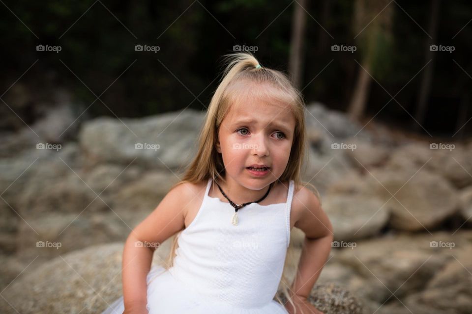 Little Caucasian girl feeling fear outdoor 