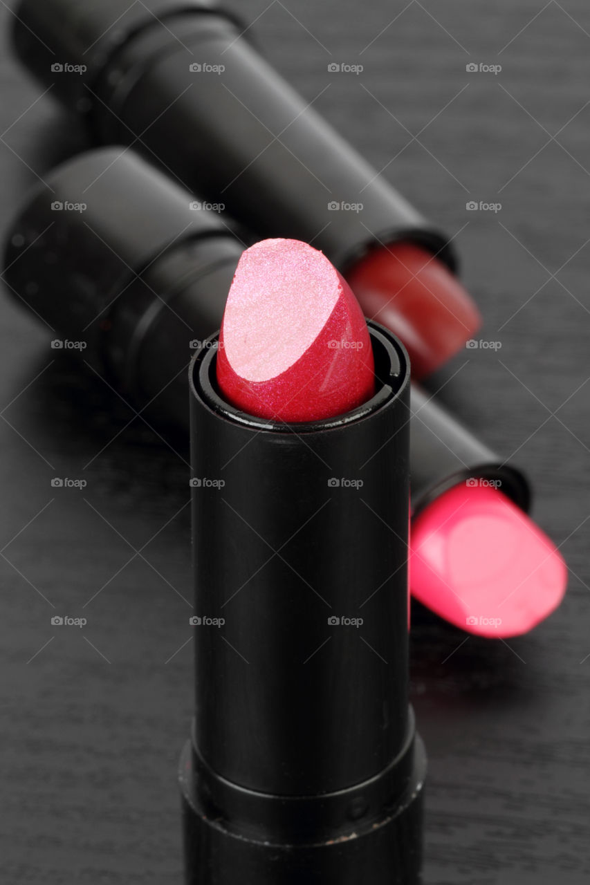 Lipsticks on black background