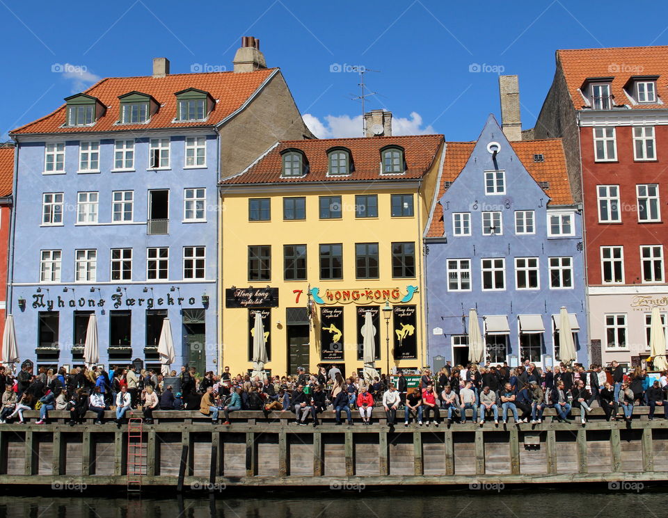 People enjoying Nyhavn in Copenhagen. People enjoying Nyhavn in Copenhagen