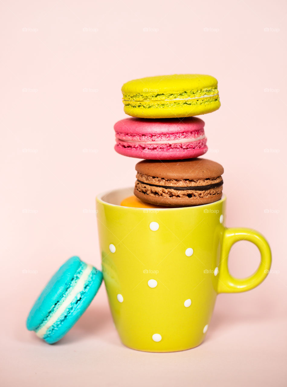 Multi colored macaroons in plate