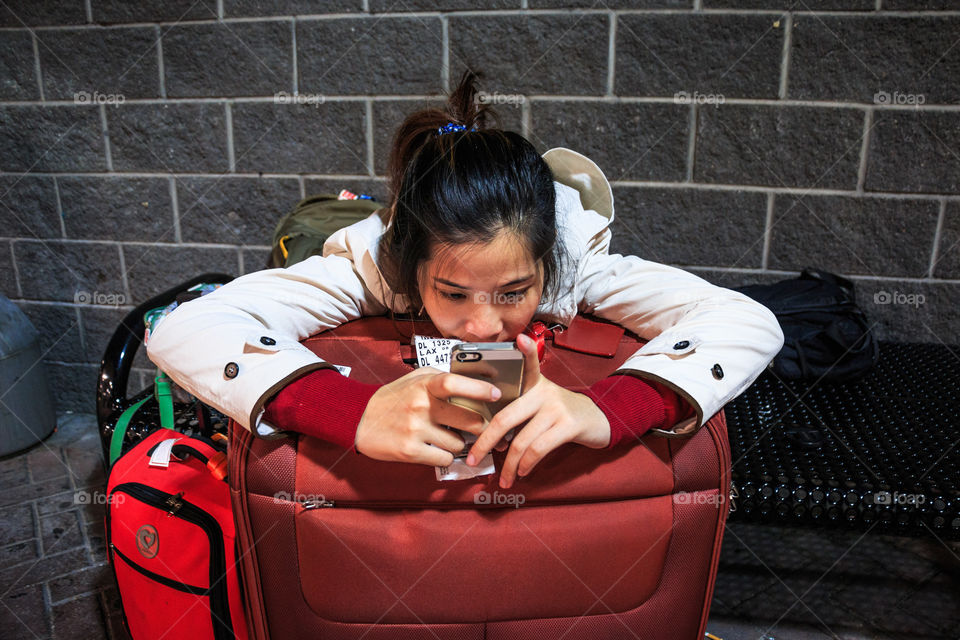 Girl playing smartphone 