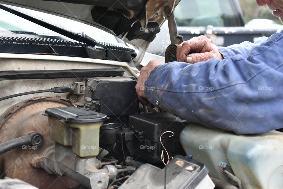 mechanic repairing a vehicle
