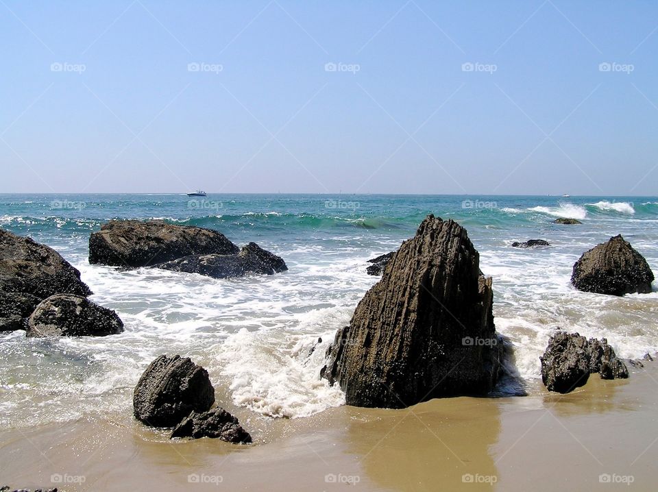 Rocks In The Surf. Rocks in the surf