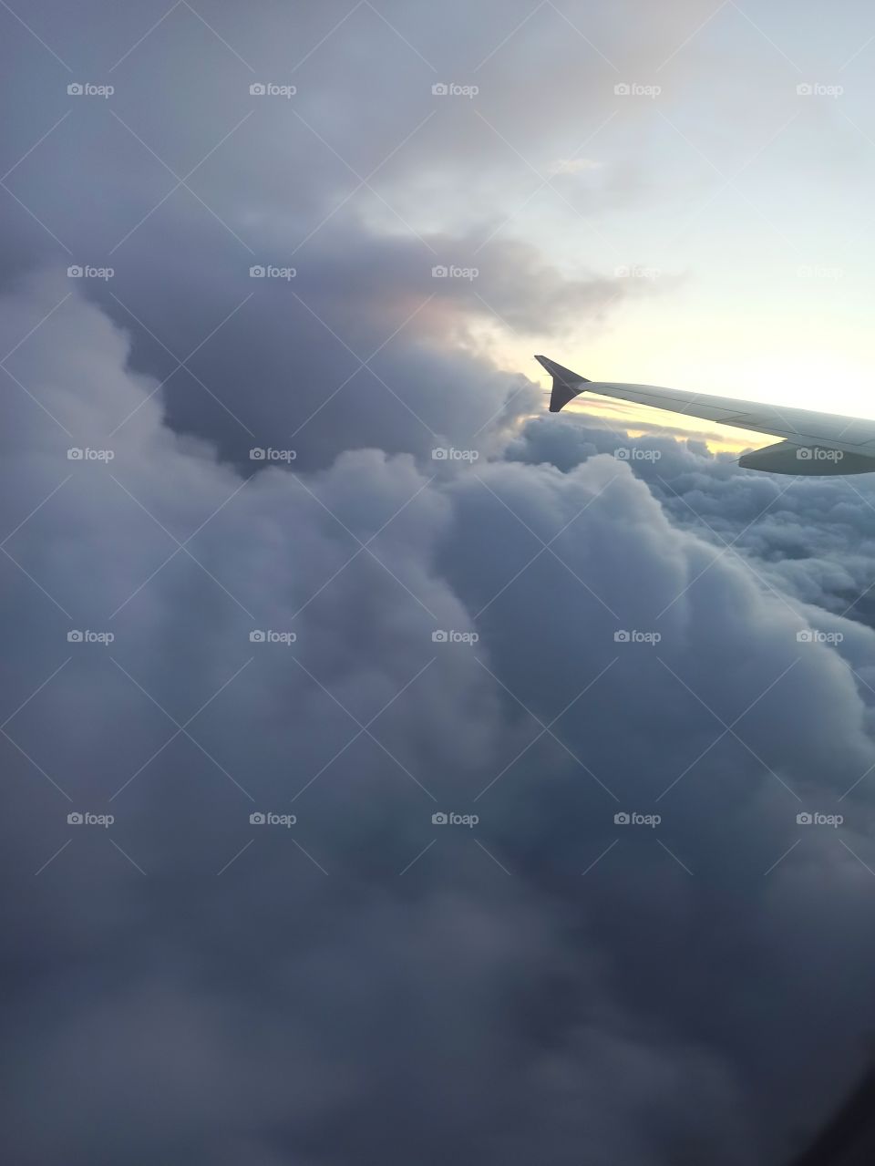 airplane flying through thick clouds