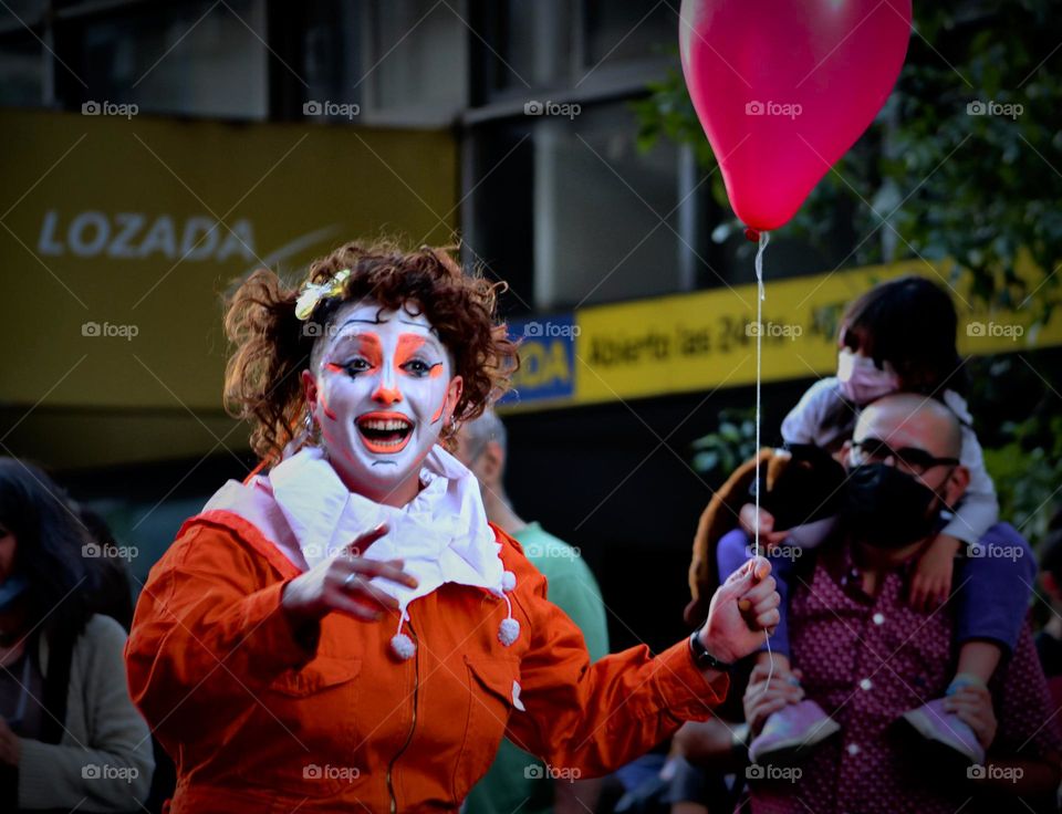 Red balloon clown, street intervention