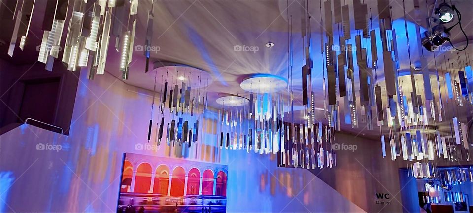 These are beautiful lustrous chandeliers in the foyer of the “DEUTSCHES THEATER”, the “GERMAN THEATER” in “Munich”, Bavaria where “FALCO”, a play about the 1980s singer of “Amadeus” and “Kommissar” is being performed. 2024. Hypnotic Productions