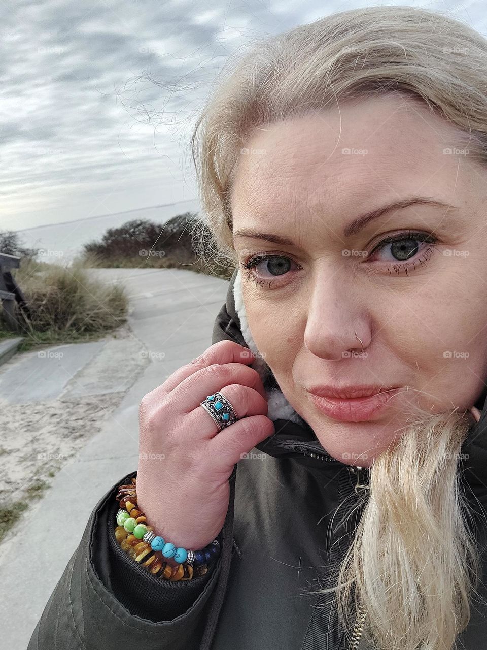 Woman with long hair on the beach winter