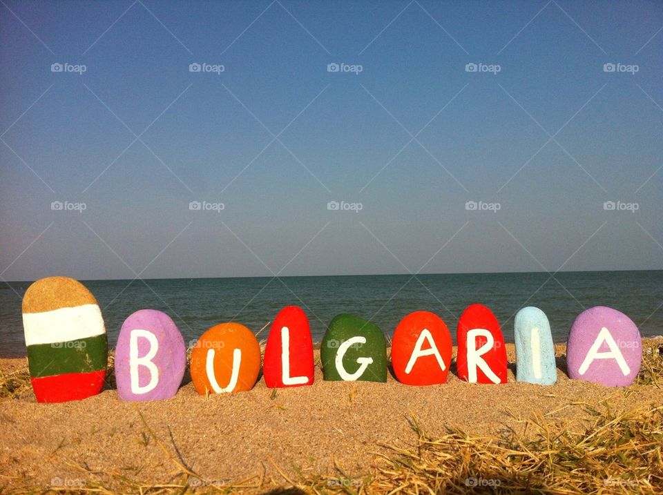 Souvenir of Bulgaria on colourful stones over the sand