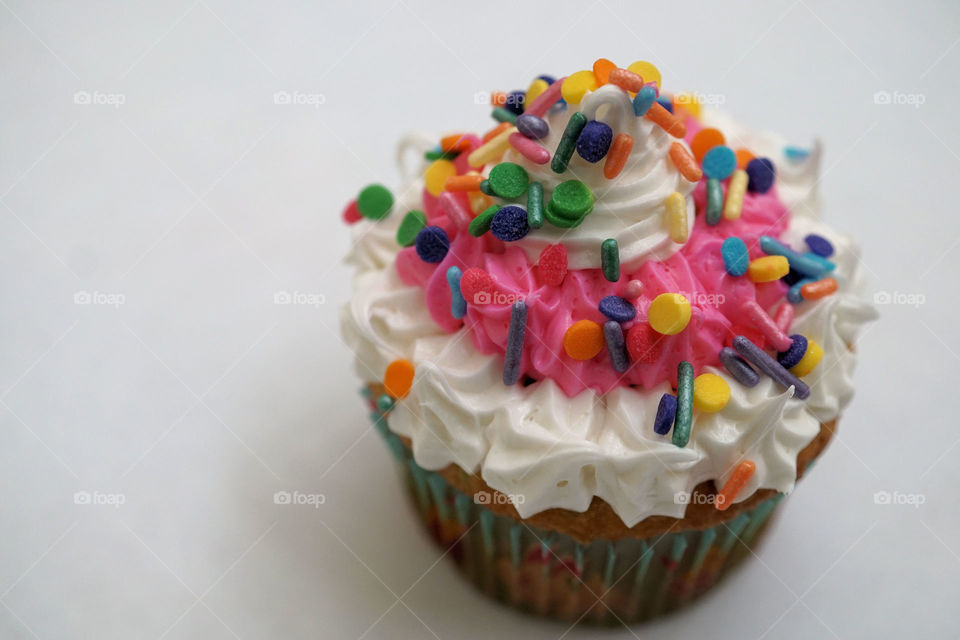 Beautifully decorated cupcakes on white background