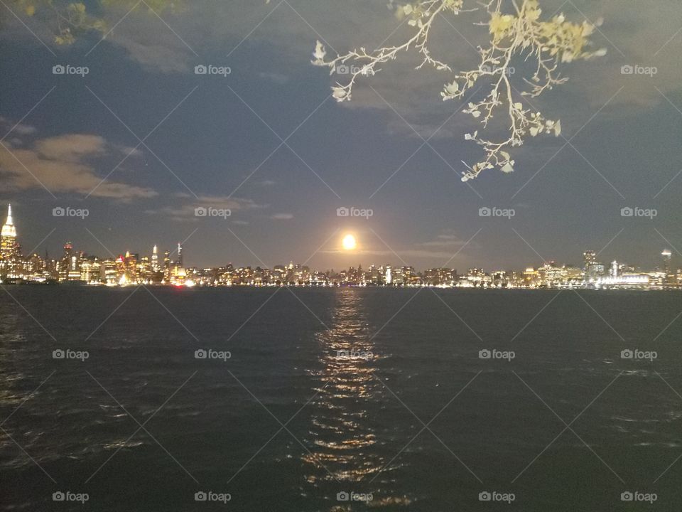 Full moon over New York skyline