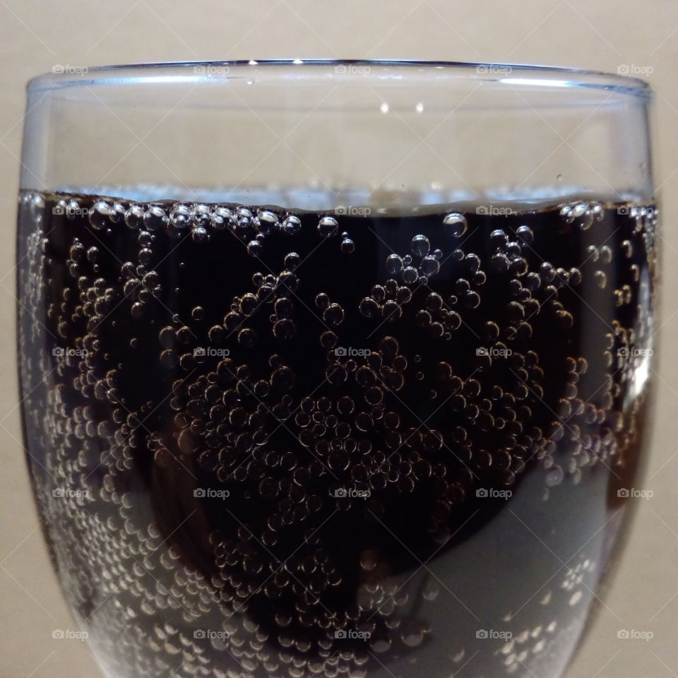 Glass of cola with bubbles