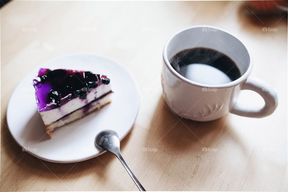 Cup of coffee with pastry cake