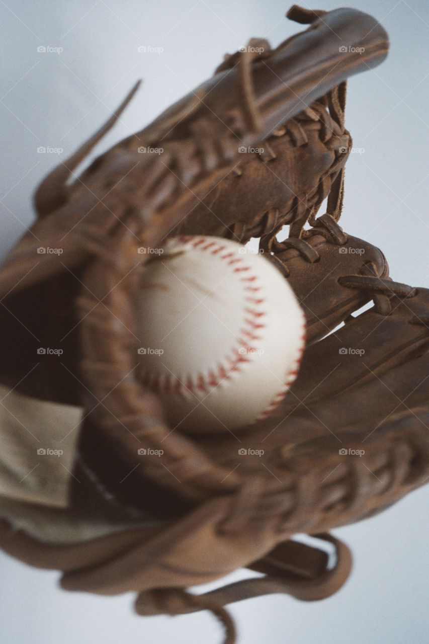 A ball in a baseball glove, shot on Canon Sureshot with 35 mm film