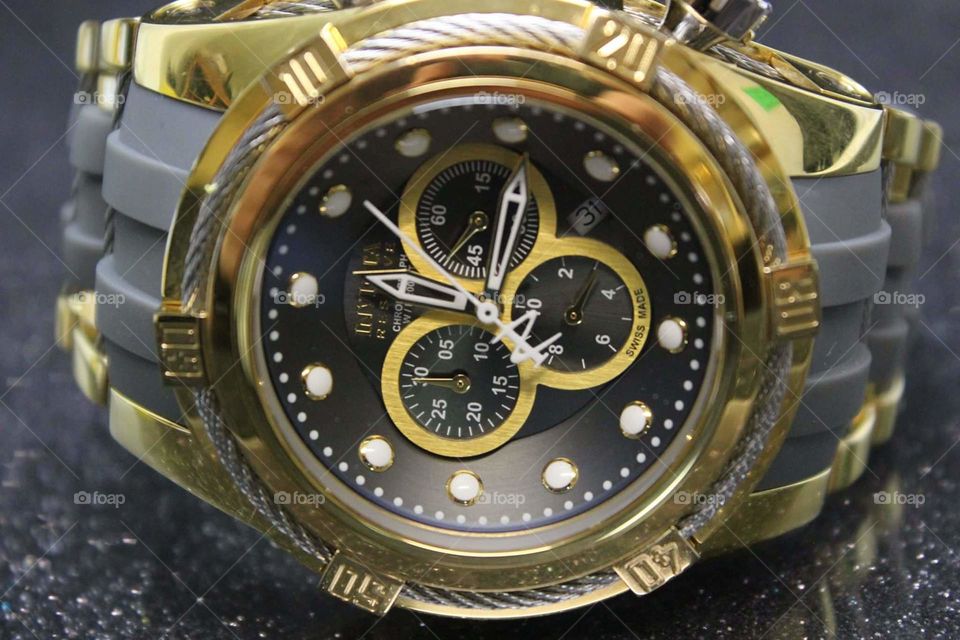 Gold and braided wire chronograph watch with stainless steel.