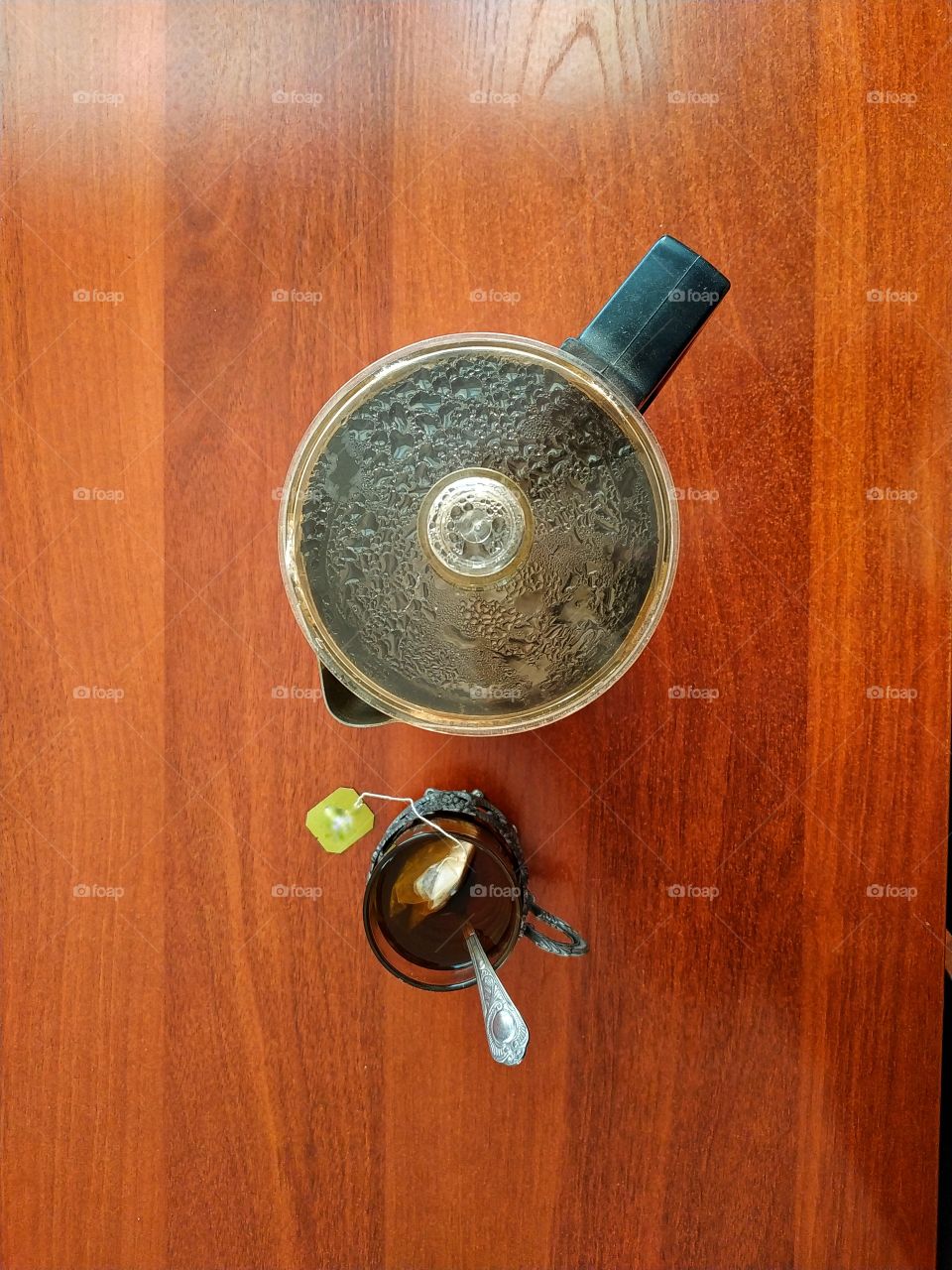 A little green tea wouldn't hurt! Teapot and Cup of tea on the table