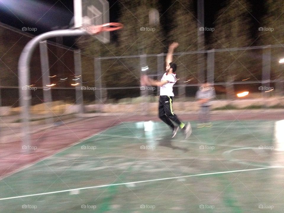 Man jump to basketball 
12/3/2016
