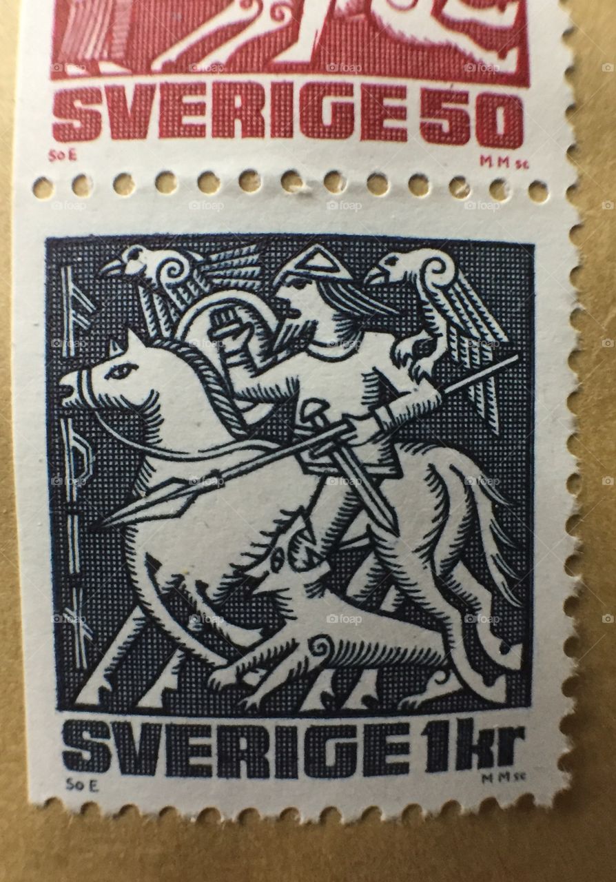 Swedish one kronor stamp showing etching of man with shield and spear on horseback with a wild dog and two falcons