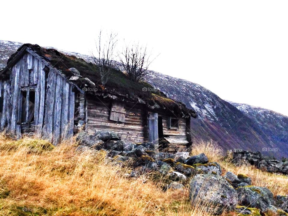 Old weathered hut in autumn
