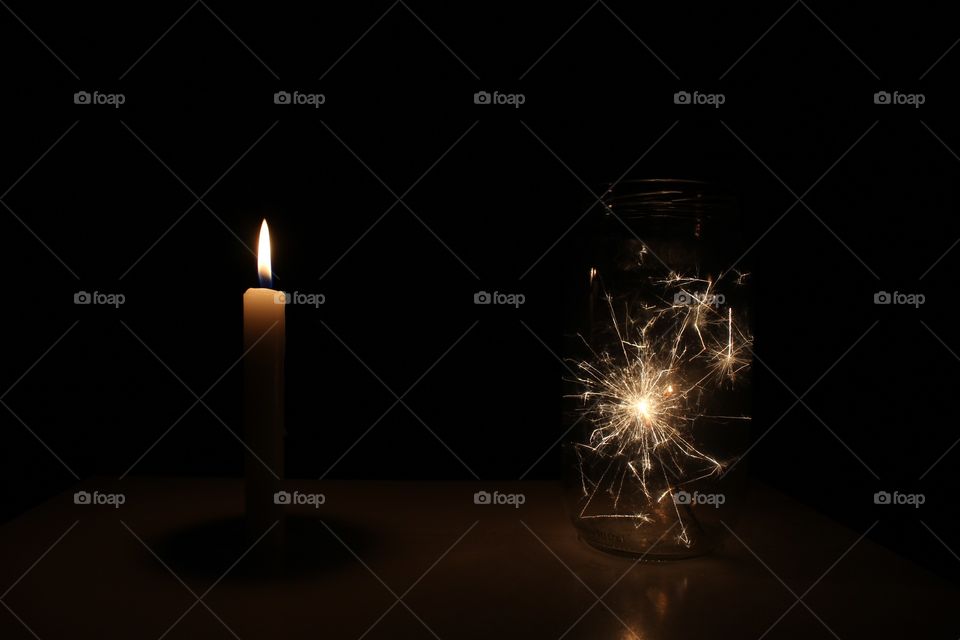 Candle and sparkles in a jar