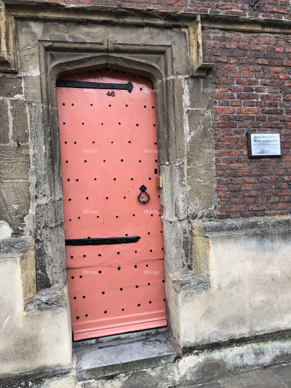 I am wondering how old this mason door to these almshouses in Somerset.