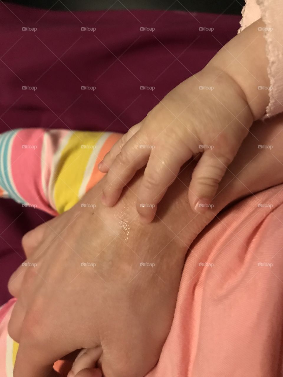 Baby Girl Hand Over Adult Hand