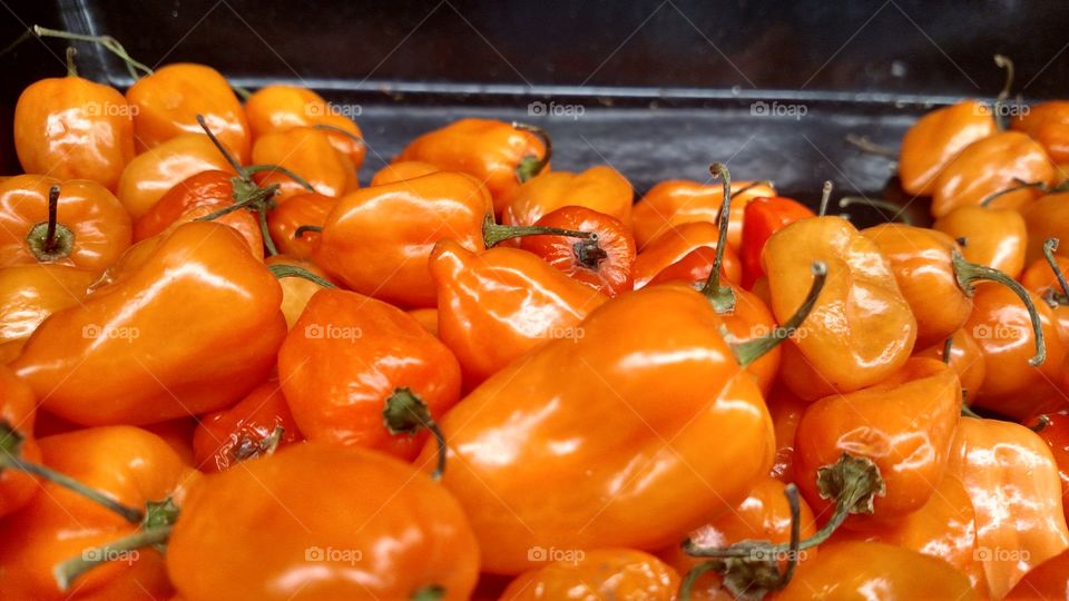 Orange market peppers.