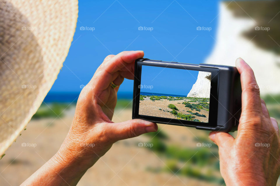 Phone . Tourist taking a picture with a smartphone cell phone mobile phone camera 