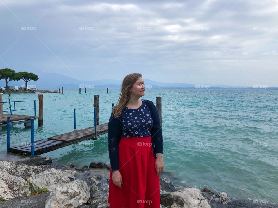 Pier of Lake Garda and woman