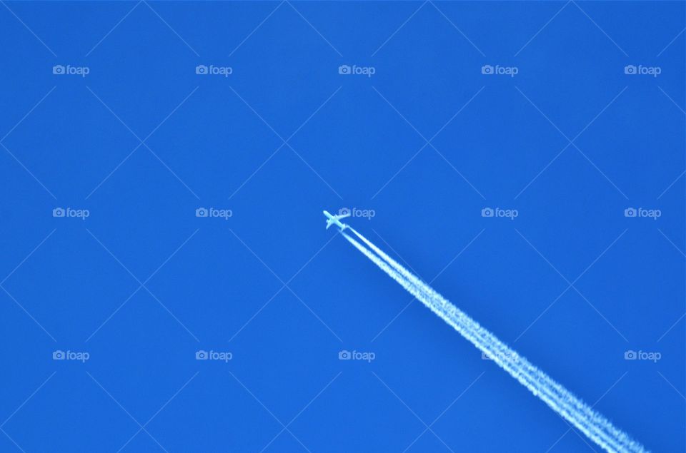 Airplane on the blue sky