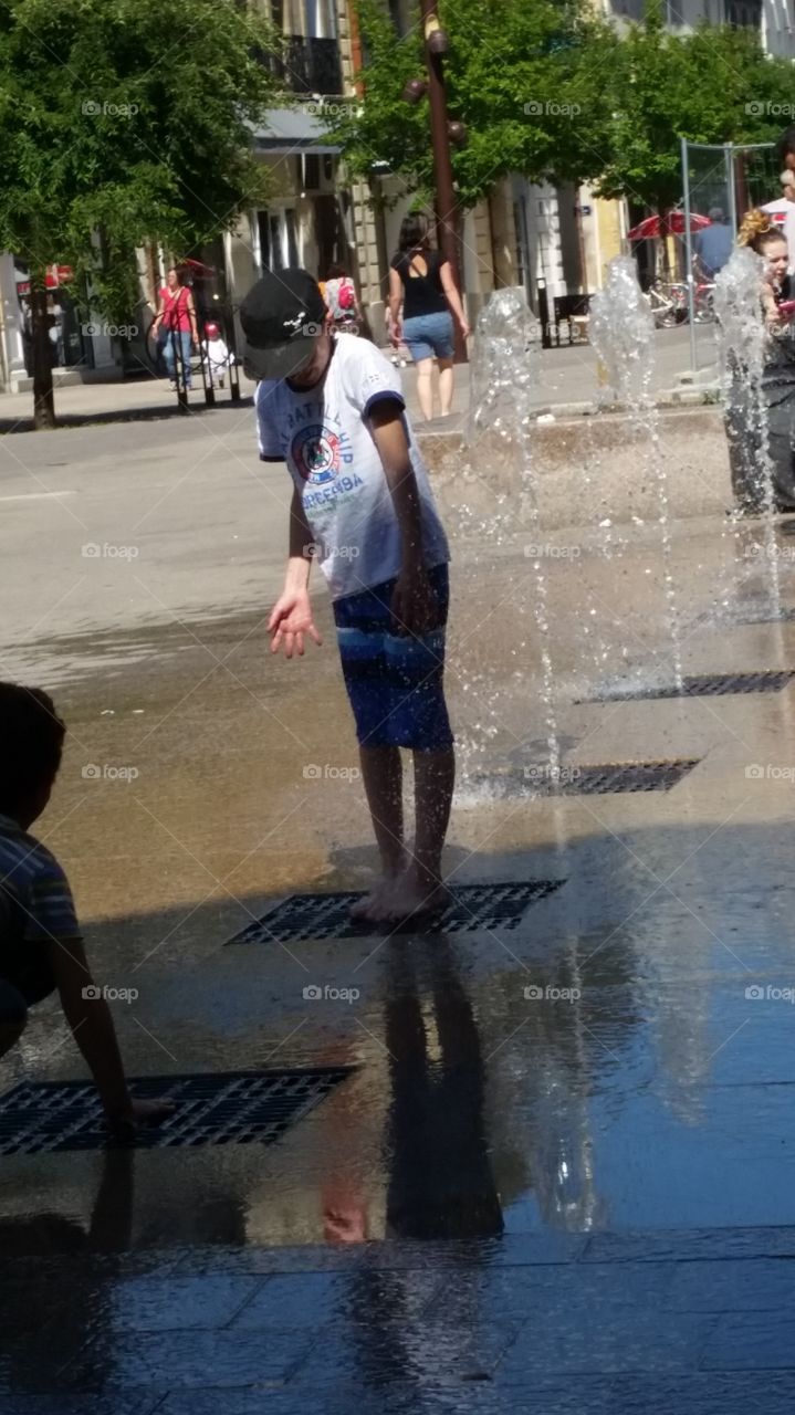 my son with the water