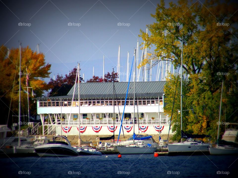 A patriotic marina with a host of boats sits on the shores of Lake Champlain in Burlington, Vermont.