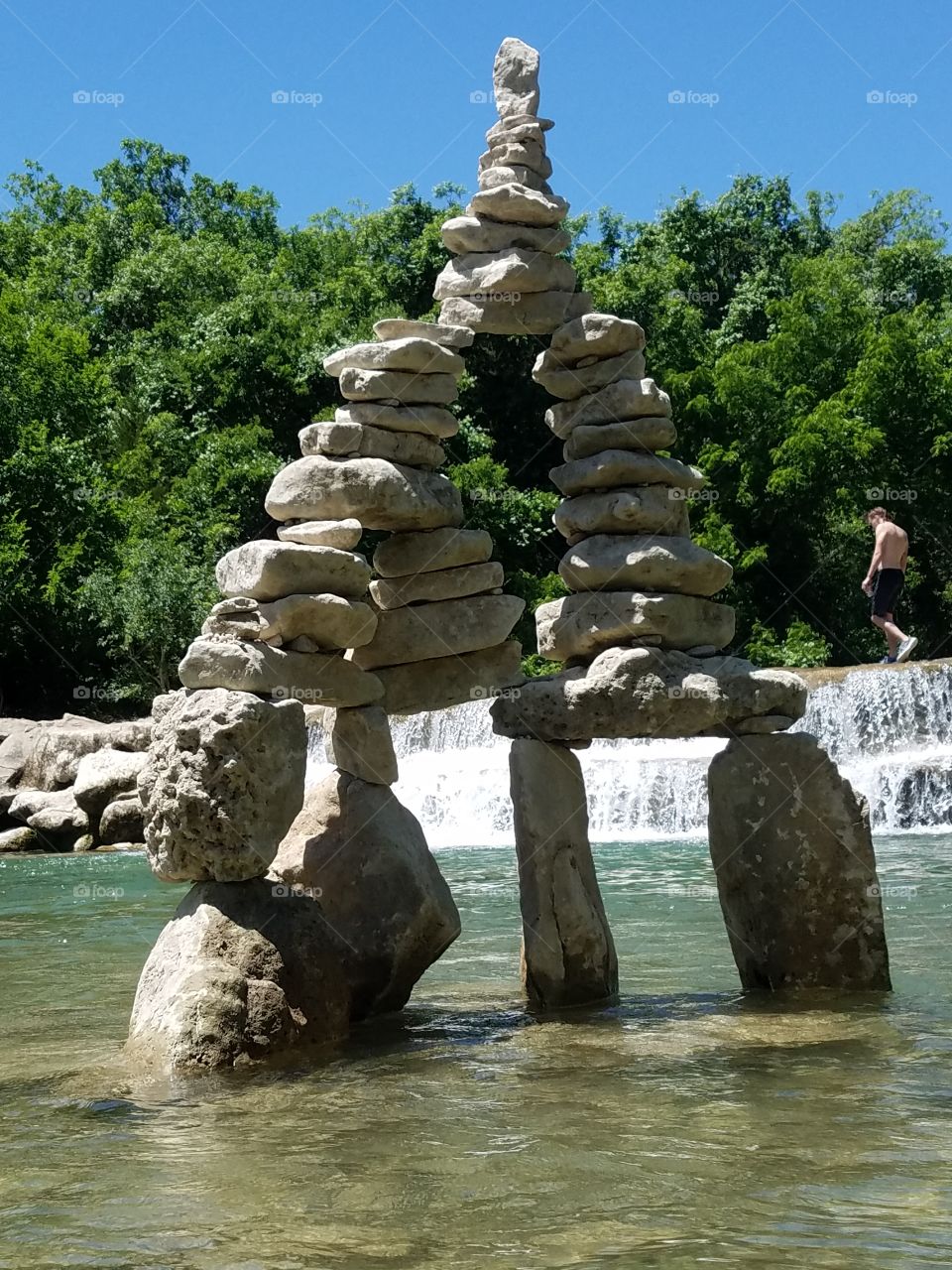 stone stack waterfall background