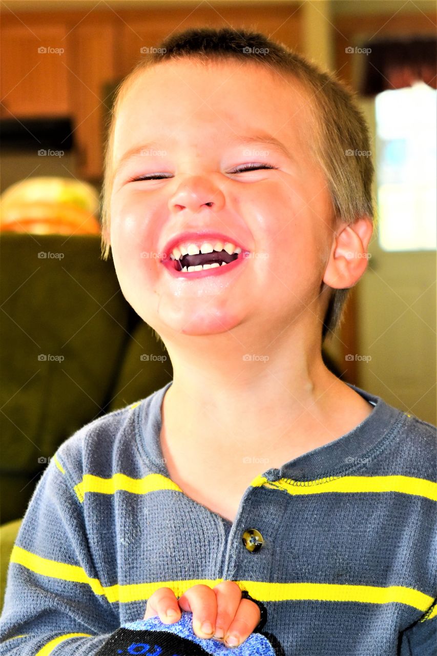 toddler boy laughing