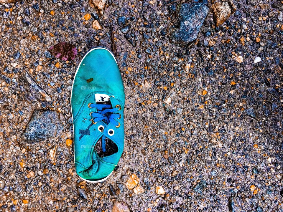 Shoe in pebbles