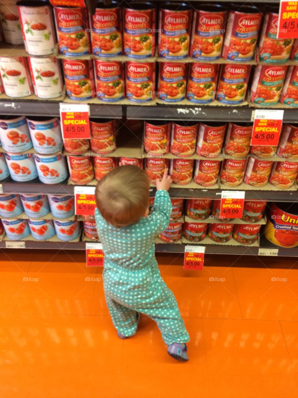 Baby in a grocery store 
