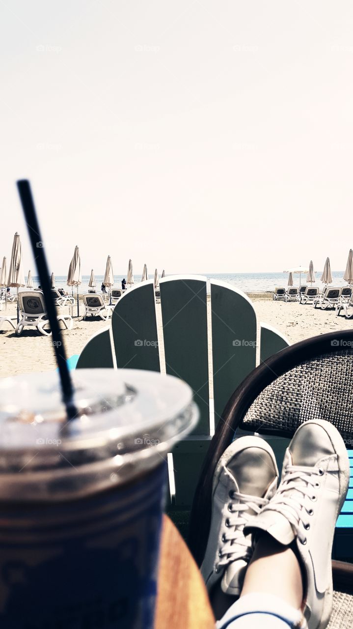Relaxing by the sea with coffee