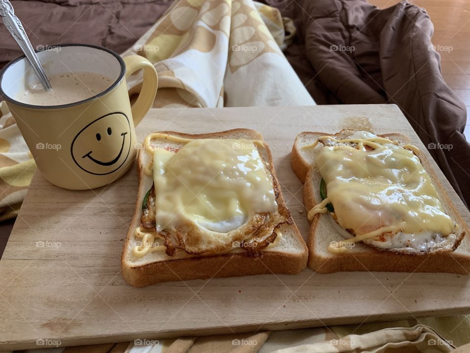 Breakfast in bed with coffee and toasted bread