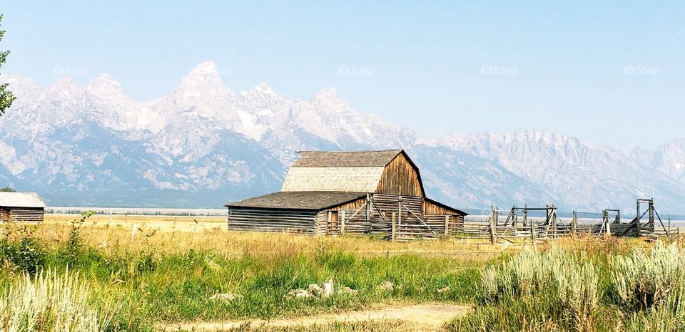 Old barn at Mormon Row with Tetons in background.