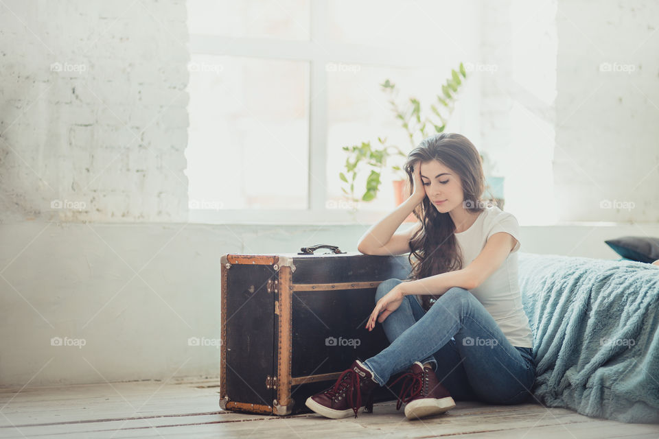 Beautiful young woman at home in daylight 