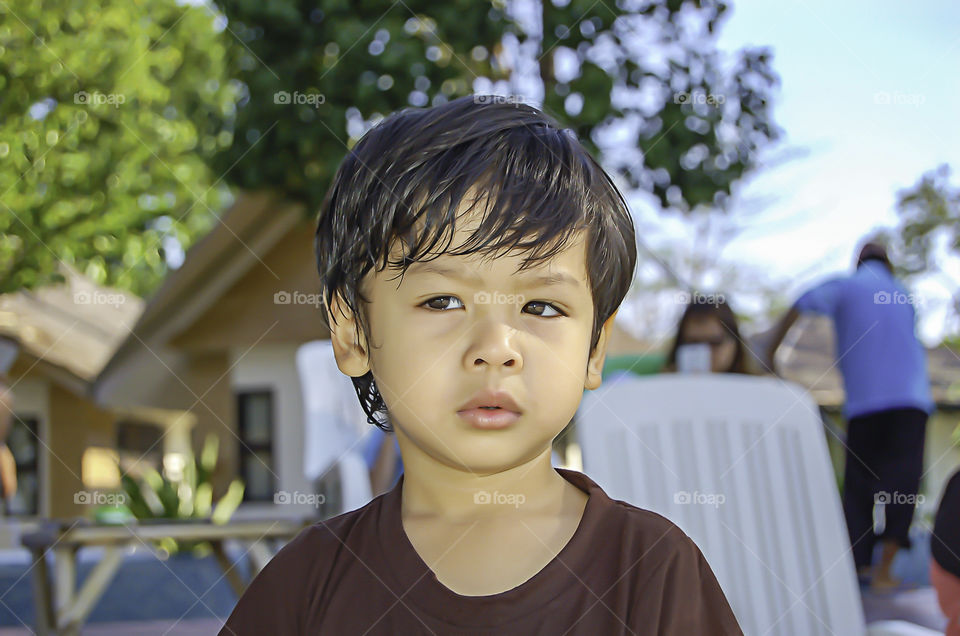 Portrait Asean boy Sitting on the beach, Koh Lipe at Satun in Thailand.