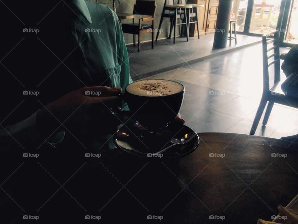 Woman holding cup of coffee 