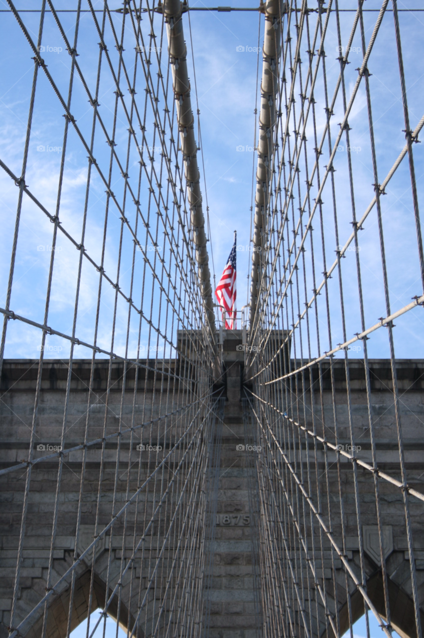 brooklyn bridge new york city structure flag blue sky by Aida