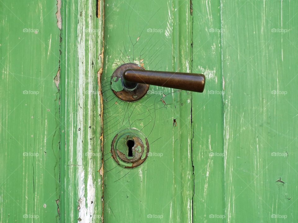 Close-up of green old door