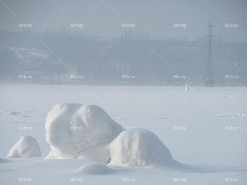 snow figures on the pond in January